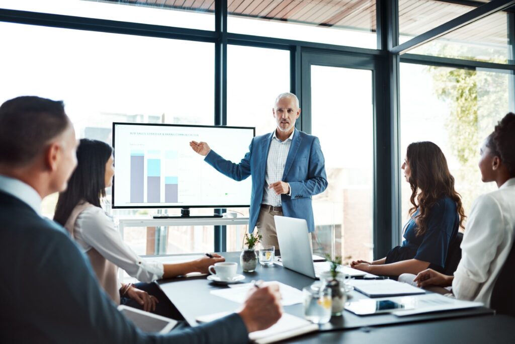 Businessman coaching people in an office setting