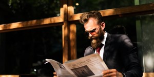 Businessman reading newspaper