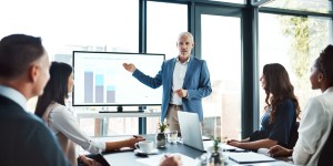 Businessman coaching people in an office setting